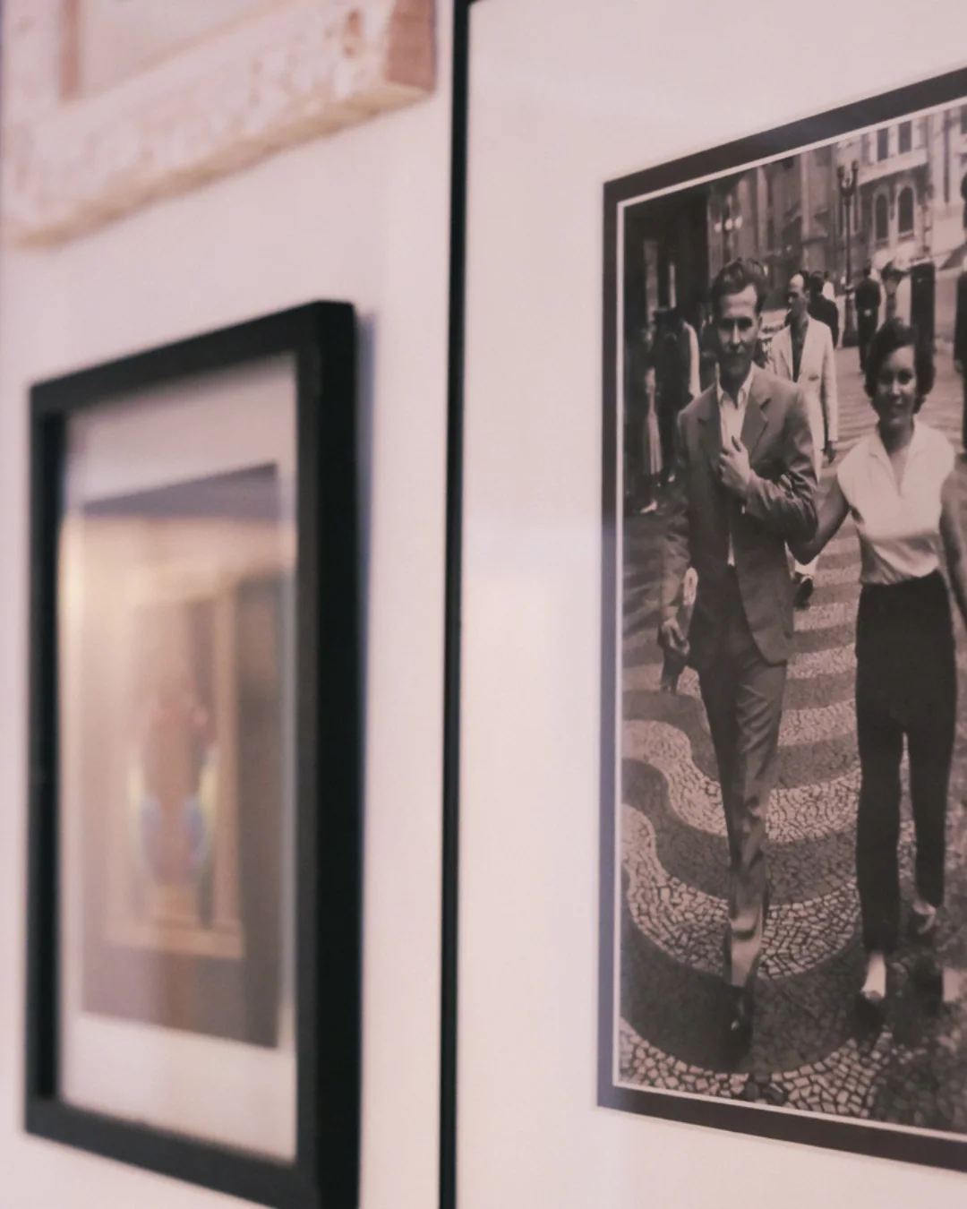Framed black and white photographs on a wall