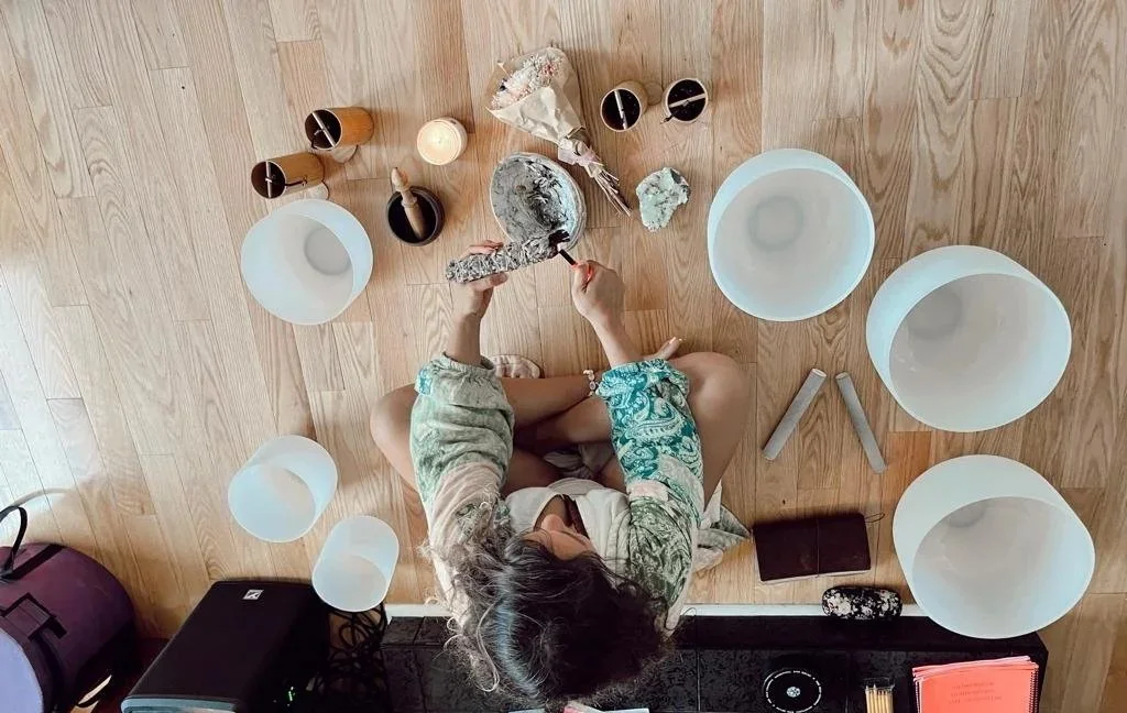 Among crystal singing bowls, seen from above